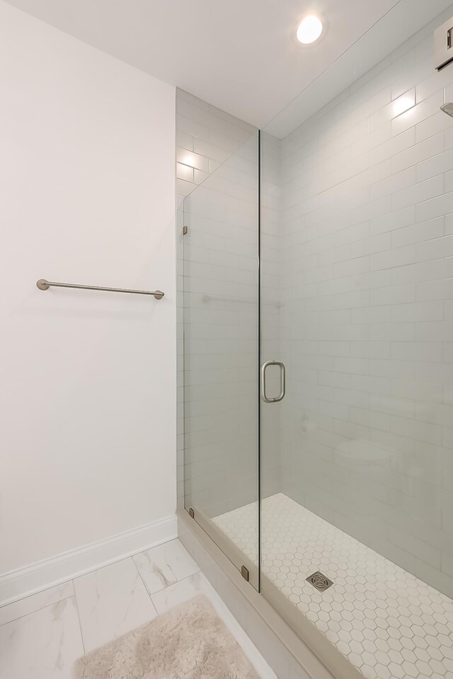 bathroom featuring an enclosed shower