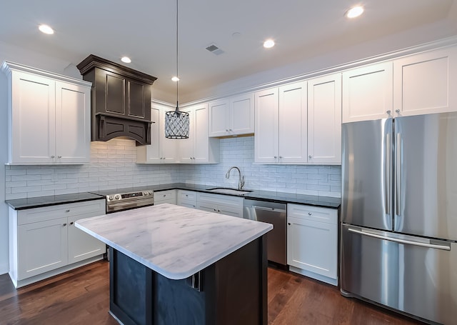 kitchen with white cabinetry, sink, and appliances with stainless steel finishes