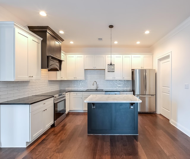 kitchen featuring backsplash, ventilation hood, hanging light fixtures, appliances with stainless steel finishes, and dark hardwood / wood-style flooring