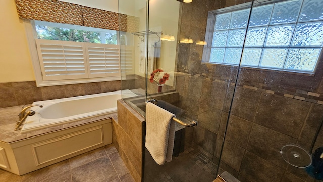 bathroom featuring separate shower and tub and tile patterned floors