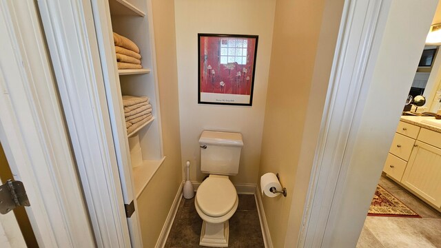 bathroom featuring vanity and toilet