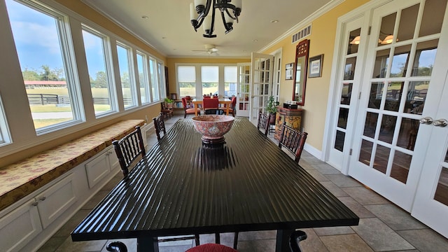 sunroom with ceiling fan and french doors