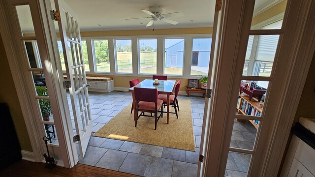 interior space with ceiling fan