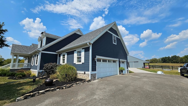 view of side of property with a yard and a porch