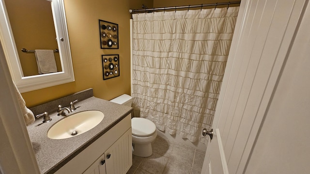 bathroom with vanity, toilet, a shower with curtain, and tile patterned floors