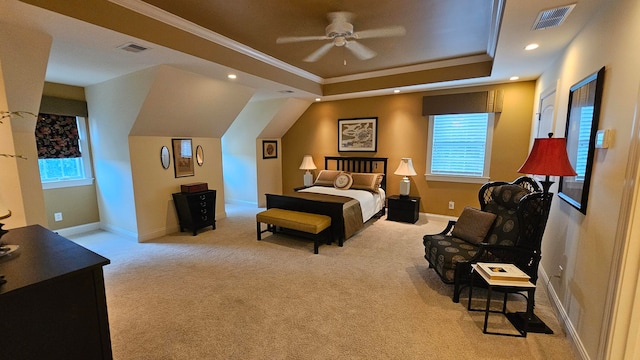 bedroom featuring a tray ceiling, multiple windows, ornamental molding, and ceiling fan