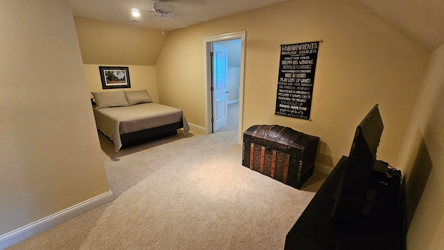 carpeted bedroom featuring vaulted ceiling