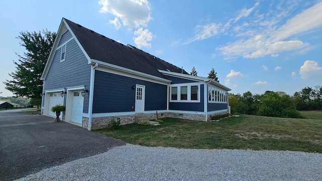 view of side of property featuring a yard