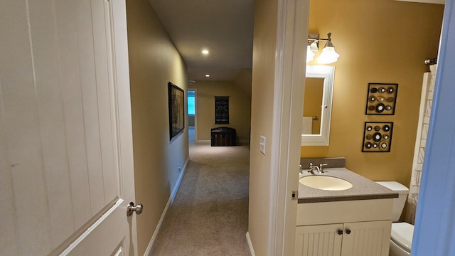 bathroom featuring toilet and vanity