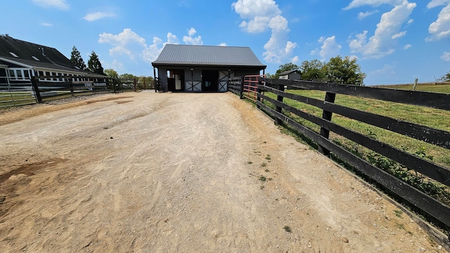 exterior space featuring an outbuilding and a rural view