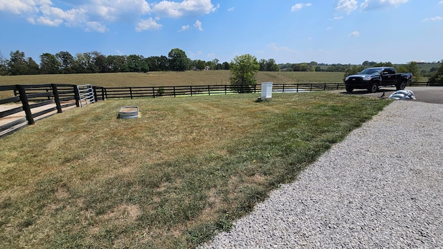 view of yard with a rural view