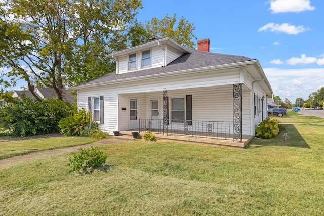 bungalow-style home with a porch and a front yard