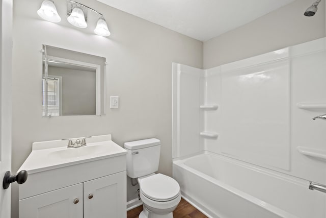 full bathroom with vanity, toilet, hardwood / wood-style floors, and bathtub / shower combination