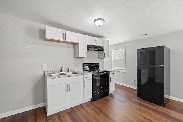 kitchen with white cabinets, dark hardwood / wood-style flooring, sink, black appliances, and a textured ceiling