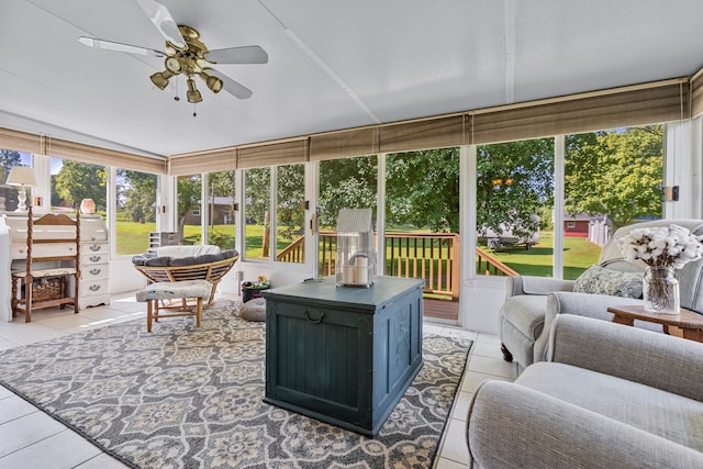 sunroom / solarium featuring ceiling fan