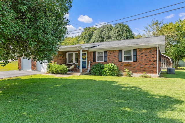 single story home with a front lawn and central AC