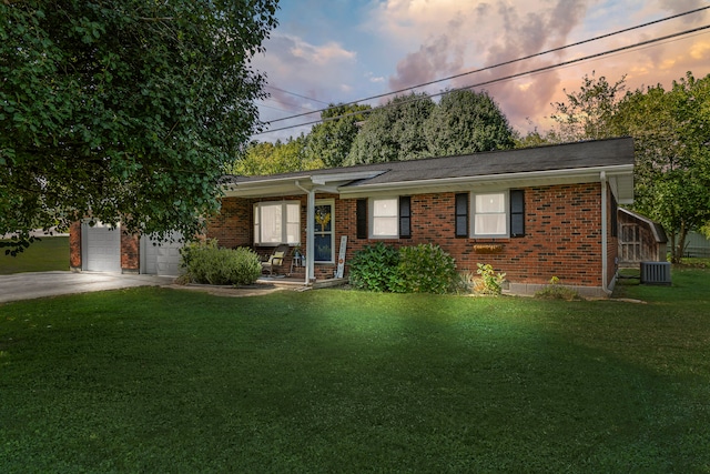 single story home with a yard and cooling unit