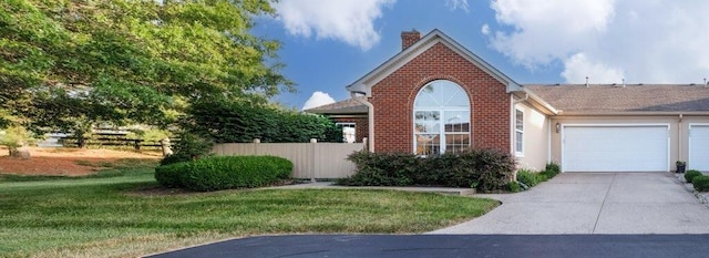 view of front facade featuring brick siding, concrete driveway, a front yard, and fence