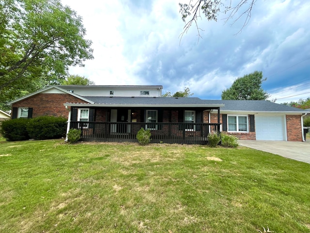 view of front facade with a garage, a front lawn, and a porch