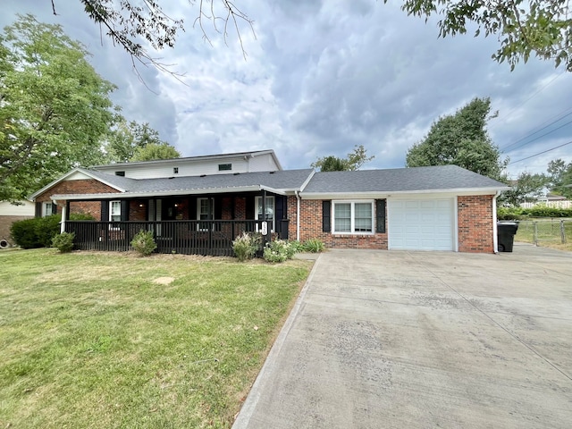 view of front of home featuring a front yard and a garage