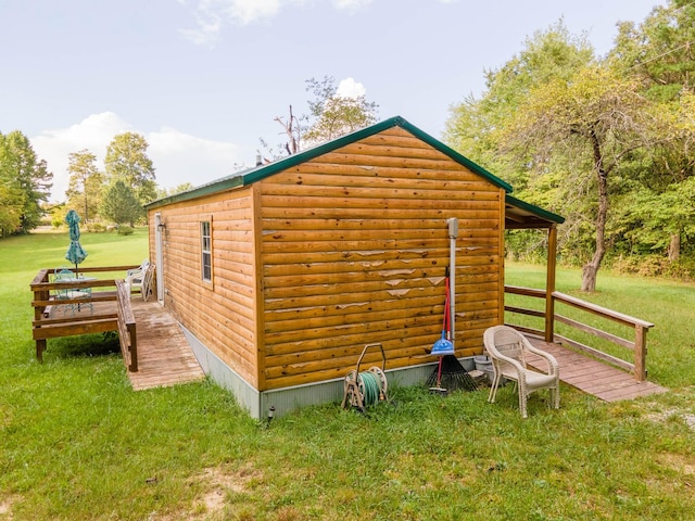 view of outdoor structure featuring a lawn