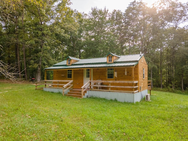 view of front of home with a front yard and a porch