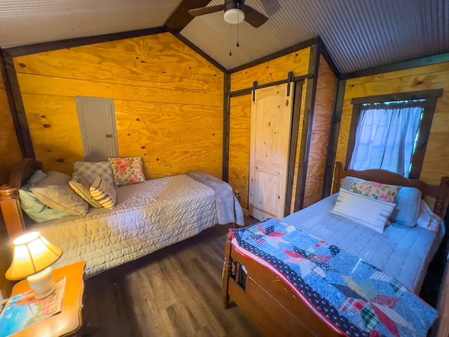 bedroom featuring wood walls, ceiling fan, dark hardwood / wood-style flooring, and vaulted ceiling