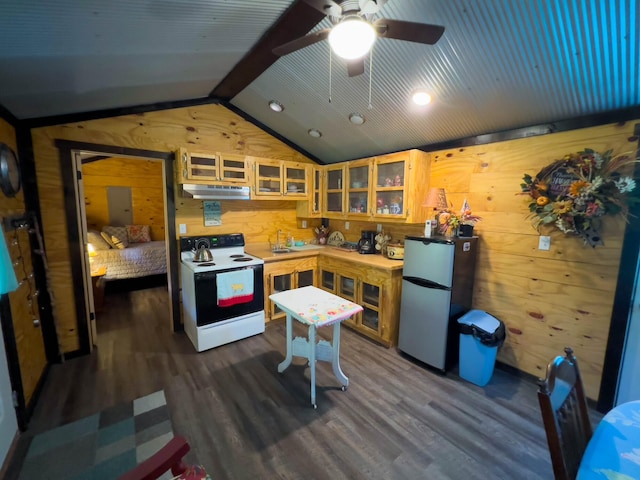 kitchen with dark hardwood / wood-style floors, stainless steel refrigerator, electric range, ceiling fan, and vaulted ceiling with beams