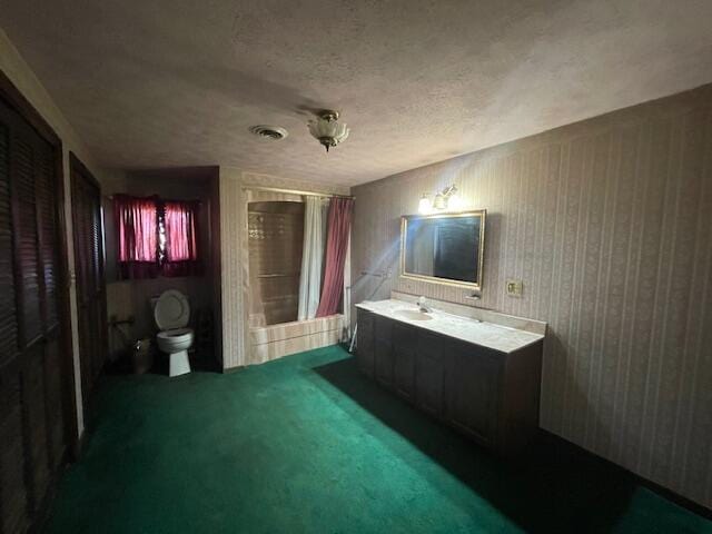 bathroom featuring a textured ceiling, vanity, toilet, and a shower with curtain