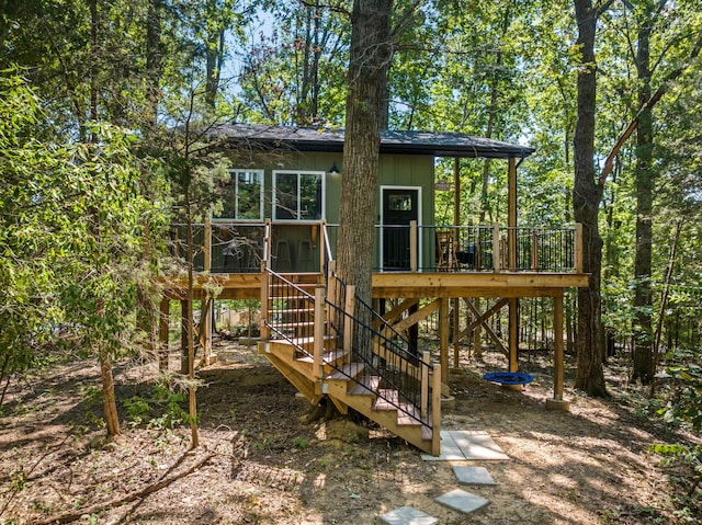 rear view of property with a wooden deck