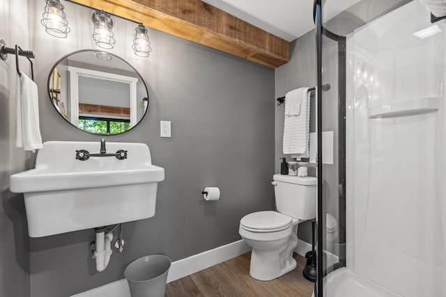 bathroom featuring walk in shower, toilet, hardwood / wood-style flooring, and sink