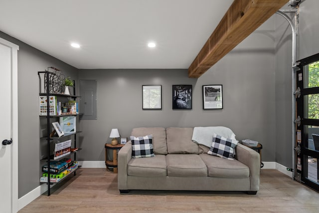 living room with hardwood / wood-style floors and electric panel