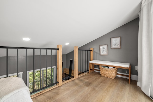 interior space with lofted ceiling and light wood-type flooring