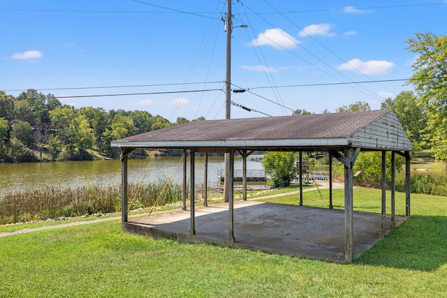 exterior space featuring a water view, a lawn, and a gazebo