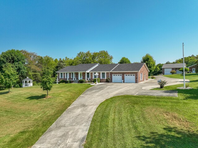 single story home with a front lawn and a garage