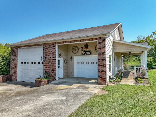 ranch-style house with a garage, a front yard, and a porch