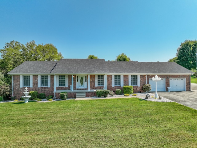 ranch-style house with a front yard and a garage