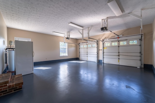 garage featuring a garage door opener and white fridge