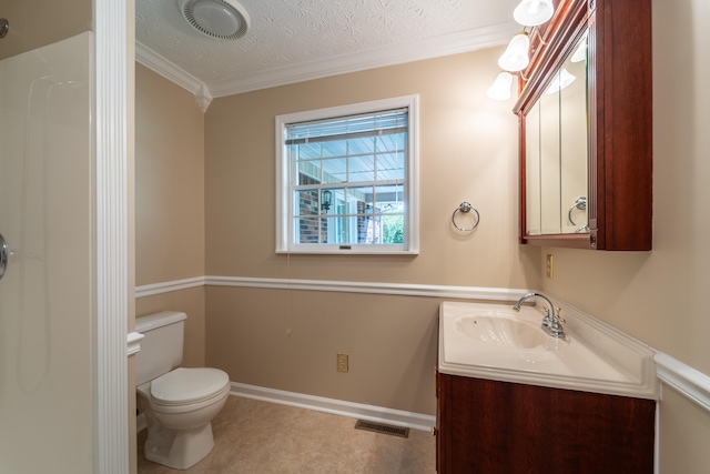 bathroom featuring a textured ceiling, vanity, toilet, and crown molding