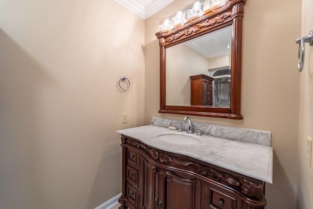 bathroom with crown molding and vanity