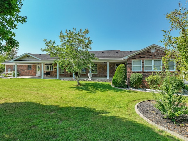 ranch-style home featuring a front yard