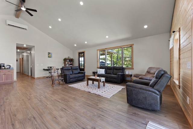 living area featuring a wall unit AC, beamed ceiling, wood finished floors, high vaulted ceiling, and recessed lighting