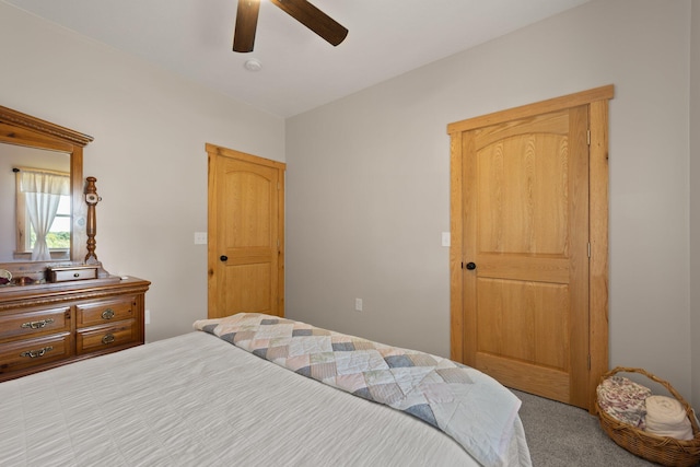 carpeted bedroom featuring a ceiling fan