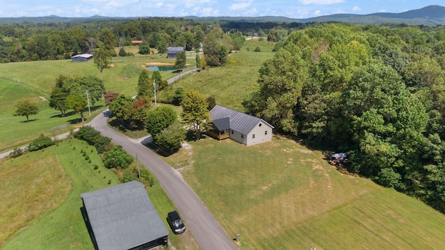 drone / aerial view with a rural view, a mountain view, and a forest view