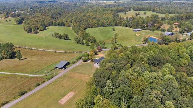 aerial view featuring a forest view and a rural view