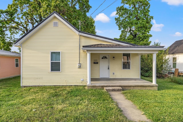 bungalow featuring a porch and a front yard