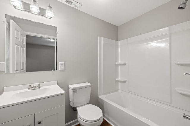 full bathroom featuring toilet, bathing tub / shower combination, and vanity