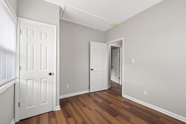 unfurnished bedroom featuring dark hardwood / wood-style floors