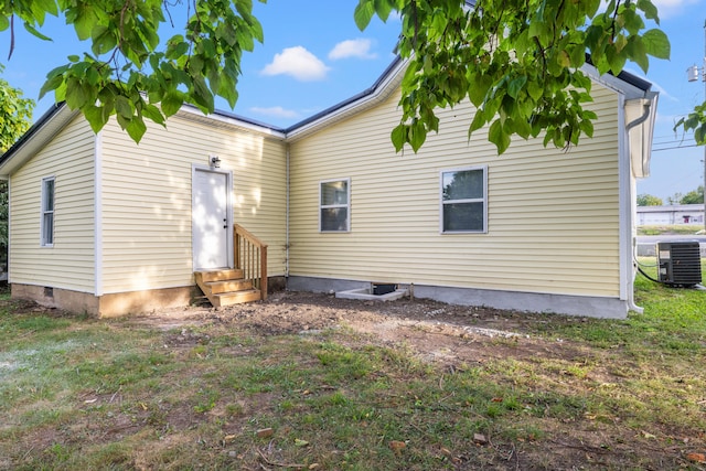 rear view of house with central air condition unit