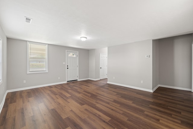 unfurnished room featuring dark wood-type flooring